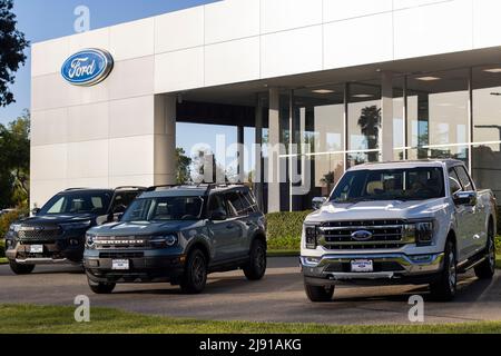 Ford pickup trucks and SUVs are seen displayed outside a Ford dealership store in Sunnyvale, California, on Tuesday, May 3, 2022. Stock Photo