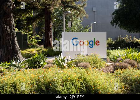 Google logo is seen at the entrance to an office building in the Google headquarters campus in Mountain View, California, on Wednesday, May 4, 2022. Stock Photo