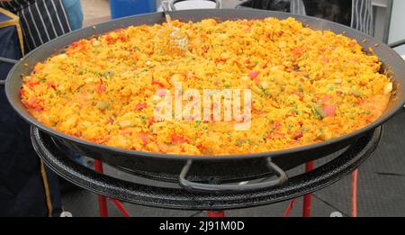 A Large Dish of Freshly Made Colourful Paella. Stock Photo