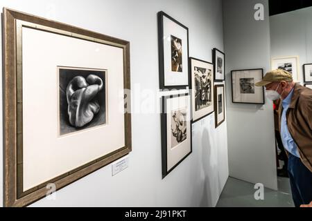 New York, USA. 19th May, 2022. Visitors admire original vintage prints by Edward Weston and other artists at The Photography Show presented by AIPAD (Association of International Photography Art Dealers) opened today in New York City. The show brings together 49 of the world's leading galleries of fine art photography. Credit: Enrique Shore/Alamy Live News Stock Photo