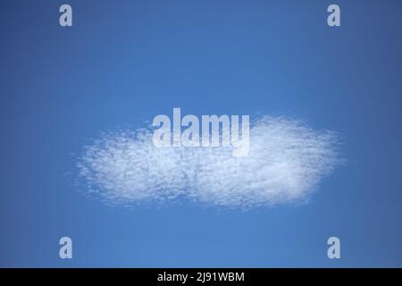 Strange white cloud scattering on the blue sky Stock Photo