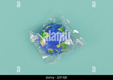 Planet earth model wrapped in plastic Stock Photo