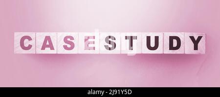 Case Study written on a wooden cubes. Examples in business and education concept Stock Photo