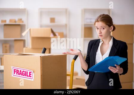 Female professional mover doing home relocation Stock Photo