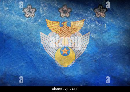 Top view of retro flag Air Defense Command of the Air Self Defense Force, Japan with grunge texture. Japanese travel and patriot concept. no flagpole. Stock Photo