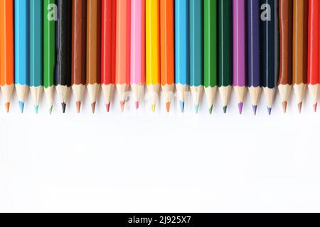 A set of colored pencils isolated on a white background in banner format. Place for text Stock Photo