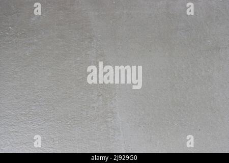 Background with grey textured pattern, grainy surface, construction surface. Stock Photo