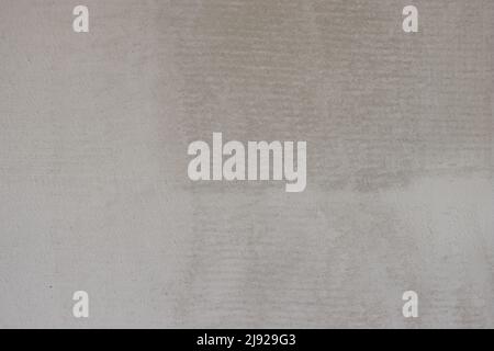 Background with grey textured pattern, grainy surface, construction surface. Stock Photo