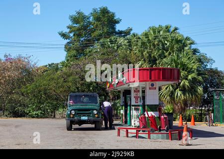Petrol station, petrol station attendant refuelling, off-road vehicle, fire extinguisher, Collantes Heights, Gran Parque Natural Topes de Collantes Stock Photo