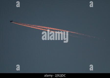 06.01.2022, Helsingborg, Skane lakes, Sweden - Airplane leaves condensation trails in the sky in the morning. 00S220106D672CAROEX.JPG [MODEL RELEASE: Stock Photo