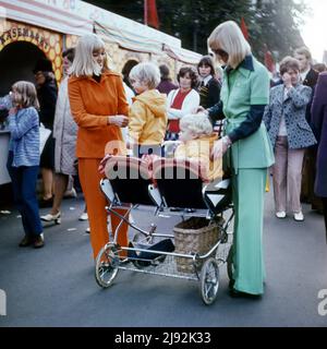 04.10.1971, Berlin, , German Democratic Republic - Woman pushes with her sister their children in a twin stroller. 00S711004D015CAROEX.JPG [MODEL RELE Stock Photo