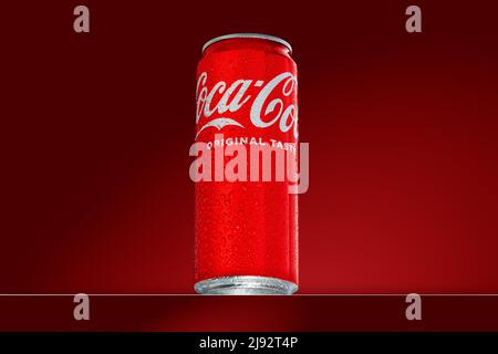 330ml can of Coca-Cola with water droplets on red background. Coca-Cola Classic. Estonia, Tallinn, May, 2022 Stock Photo
