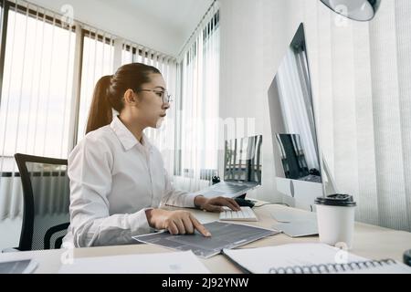 Developing programming and coding technology working in a software engineers developing applications in office. Stock Photo