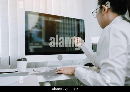 Developing programming and coding technology working in a software engineers developing applications in office. Stock Photo