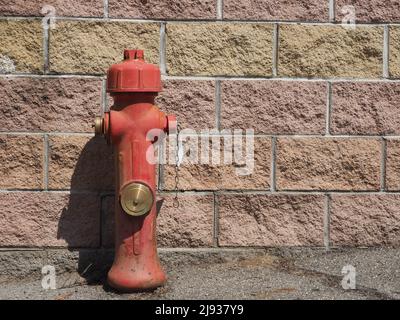 Fire hydrant before a wall Stock Photo - Alamy