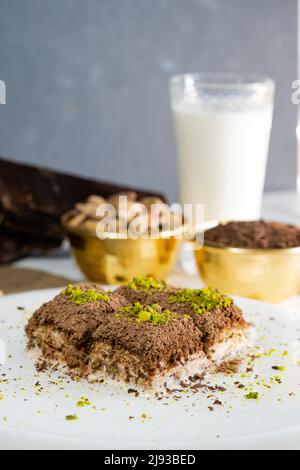 Pistachio cold baklava on white marble. Traditional middle eastern dessert. Turkish Antep baklava. Stock Photo