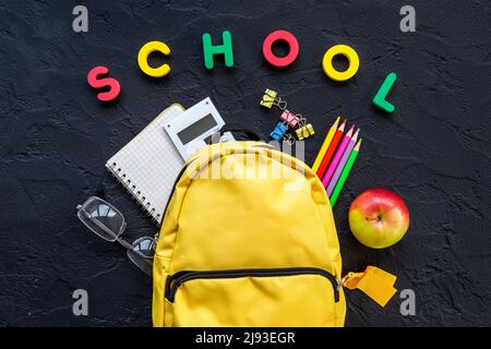 School backpack with school items and students equipment, top view Stock Photo