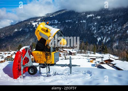 Snow cannon machine blowing artificial snow on Azuga ski domain, Prahova  Valley region, Romania, during the Winter low season, due to the lack of  natu Stock Photo - Alamy