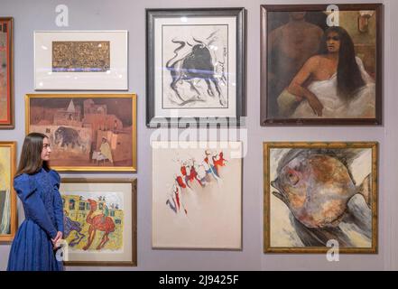 Bonhams, New Bond Street, London, UK. 20 May 2022. Modern and Contemporary South Asian Art sale live auction takes place on 24 May. Image: General view of lots being sold for A Charity Auction of Pakistani Art on behalf of Welfare Society for Patient Care. Credit: Malcolm Park/Alamy Live News Stock Photo