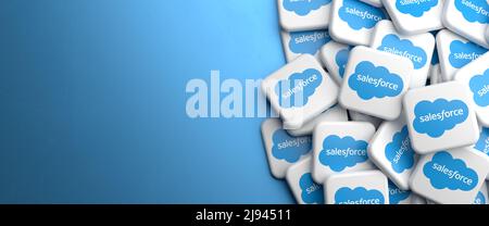 Logos of the company salesforce which offers cloud based solutions for Customer Relationship Management on a heap on a table. Copy space. Web banner f Stock Photo