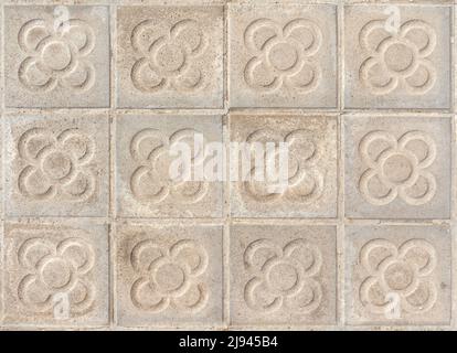 Barcelona pavement tiles with a flower, panot slabs with symbol texture top view Stock Photo