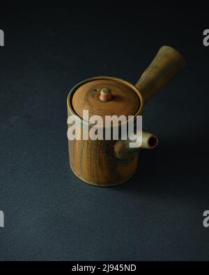 Japanese Asian style teapot, copy space, dark photo Stock Photo