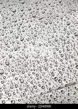 Abstract background with small raindrops on imperfect metal. Raindrops on children's metal slide do not allow to use it Stock Photo