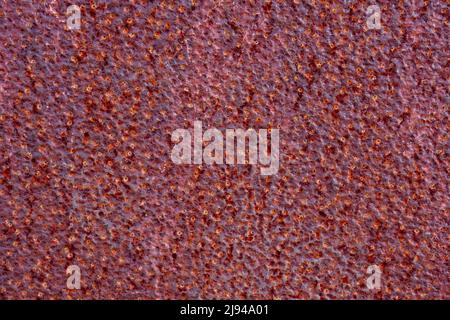 Close up of a piece of heavily corroded and pitted steel plate. Stock Photo