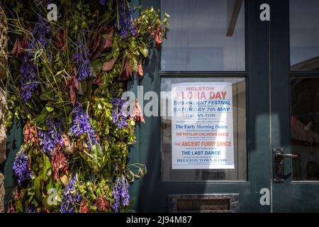 Flora Day sign on the Town Hall in Helston, Cornwall. The May festival is a celebration of the passing of winter and the arrival of spring. Residents Stock Photo