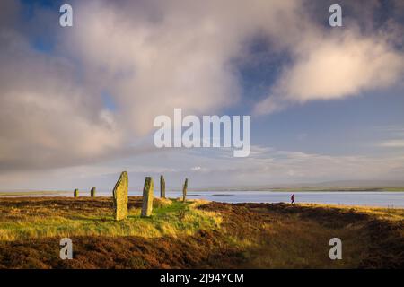 Walker on the Ring of Brodgar, Mainland, Orkney Isles, Scotland, UK Stock Photo