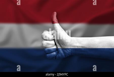 Hand making thumb up painted with flag of netherlands Stock Photo