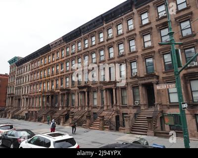 Multiple houses situated on the Malcolm X Boulevard in Manhattan. Stock Photo