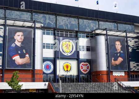 Glasgow, UK. 20th May, 2022. Hampden Park, the national stadium for Scottish football prepares for the 2022 Scottish Cup final on 21 May between Rangers FC and Heart of Midlothian by hanging club pendants at the front entrance. The last time Rangers won the Scottish Cup was in 2009 and Hearts last won it in 2012. The two team last met at Ibrox on 14 May 2022 when Rangers won 3 - 1. Credit: Findlay/Alamy Live News Stock Photo