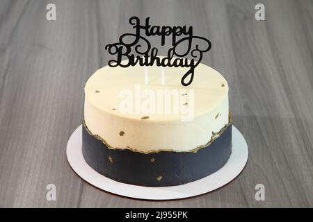Festive cake for a child's birthday. The inscription on the cake "Happy birthday!". Very beautiful and original cake. Culinary desserts. Stock Photo