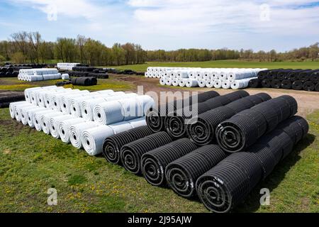 Clifford, Michigan - Corrugated plastic drainage pipe stocked at an Advanced Drainage Systems factory. The pipe is used in agriculture, road building, Stock Photo