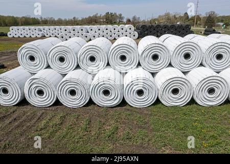 Clifford, Michigan - Corrugated plastic drainage pipe stocked at an Advanced Drainage Systems factory. The pipe is used in agriculture, road building, Stock Photo