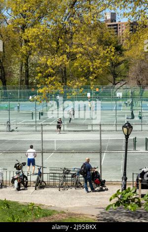 Players enjoying a spring afternoon at Central Park Tennis Center in New York City, USA  2022 Stock Photo