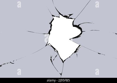 Broken glass hole. Photo of cracks on the window. Texture for design. Stock Photo