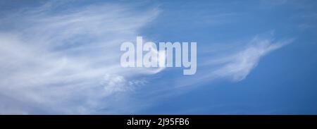 Light clouds in the blue sky, panorama of clear sunny sky. Stock Photo