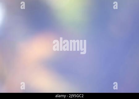 abstract and defocused background with pastel colors in shades of yellow, pink, green and blue Stock Photo