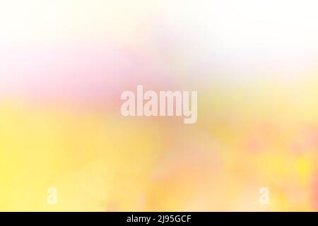 abstract and defocused background with pastel colors in shades of yellow, pink, green Stock Photo