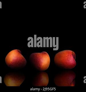 three peaches with reflections on a table with a black background Stock Photo
