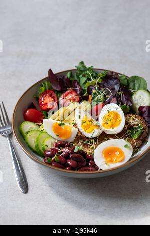 Medium boiled eggs with sasld, healthy breakfast Stock Photo