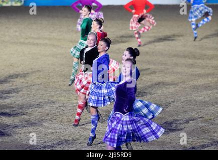 The Dancers of the Royal Edinburgh Military Tattoo put on a colourful display of Scottish Dancing. Guests were thrilled to watch the Platinum Jubilee Celebration this evening in the presence of The Princess Royal in the private grounds of Windsor Castle. 500 horses and 1,300 participants from across the Commonwealth and the World took part in the theatrical event entitled A Gallop Through History to celebrate the Reign of Her Majesty the Queen Stock Photo