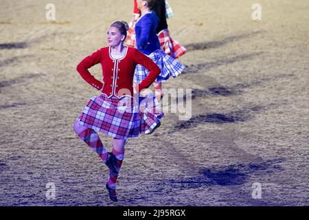 The Dancers of the Royal Edinburgh Military Tattoo put on a colourful display of Scottish Dancing. Guests were thrilled to watch the Platinum Jubilee Celebration this evening in the presence of The Princess Royal in the private grounds of Windsor Castle. 500 horses and 1,300 participants from across the Commonwealth and the World took part in the theatrical event entitled A Gallop Through History to celebrate the Reign of Her Majesty the Queen Stock Photo