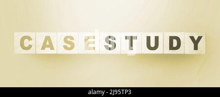 Case Study written on a wooden cubes. Examples in business and education concept Stock Photo