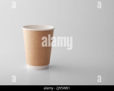 Brown takeaway paper cup on white background. Stock Photo