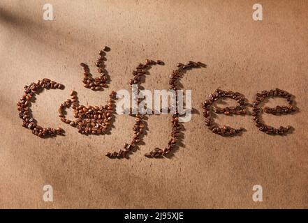 Image of the word coffee written in whole coffee beans Stock Photo