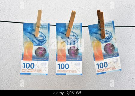 swiss haning money 100 franc banknote Stock Photo