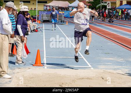 Fort Ft. Lauderdale Florida,Ansin Sports Complex Track & Field National Senior Games,man male long jump competition competitor jumping Stock Photo